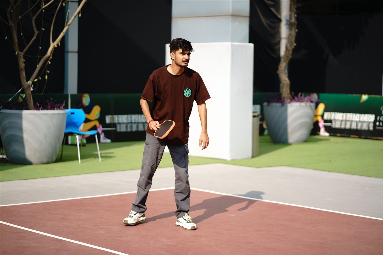 A man playing pickleball outdoors
